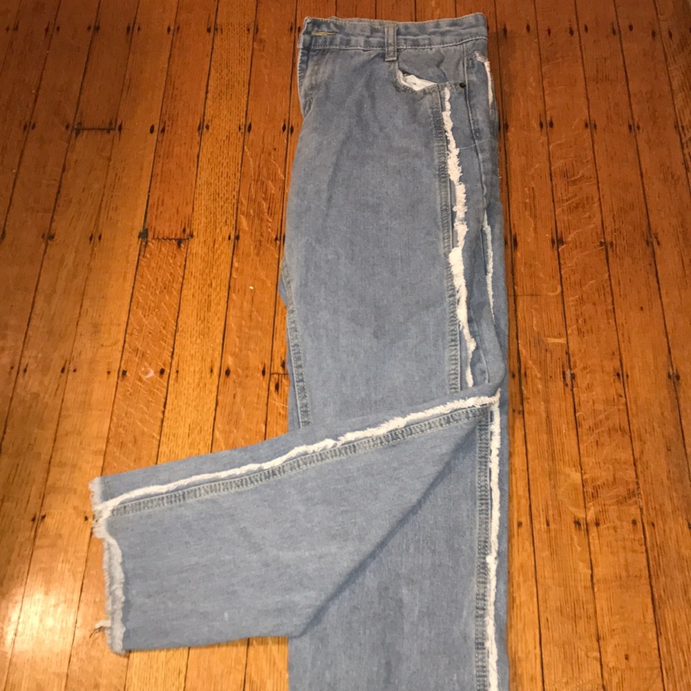 Blue jeans with white fringe